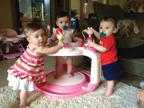 triplets at 10 months standing