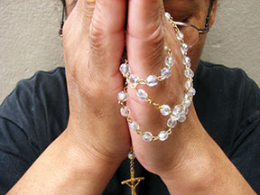 praying-rosary-file0001508606271