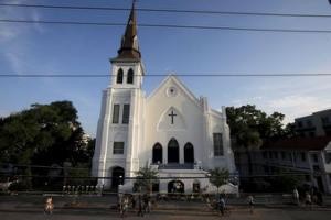 Members of the public continue to pay their respects and leave flowers outside the Emanuel African Methodist Episcopal Church in Charleston, South Carolina June 19, 2015, two days after a mass shooting left nine dead during a bible study at the church. REUTERS/Brian Snyder